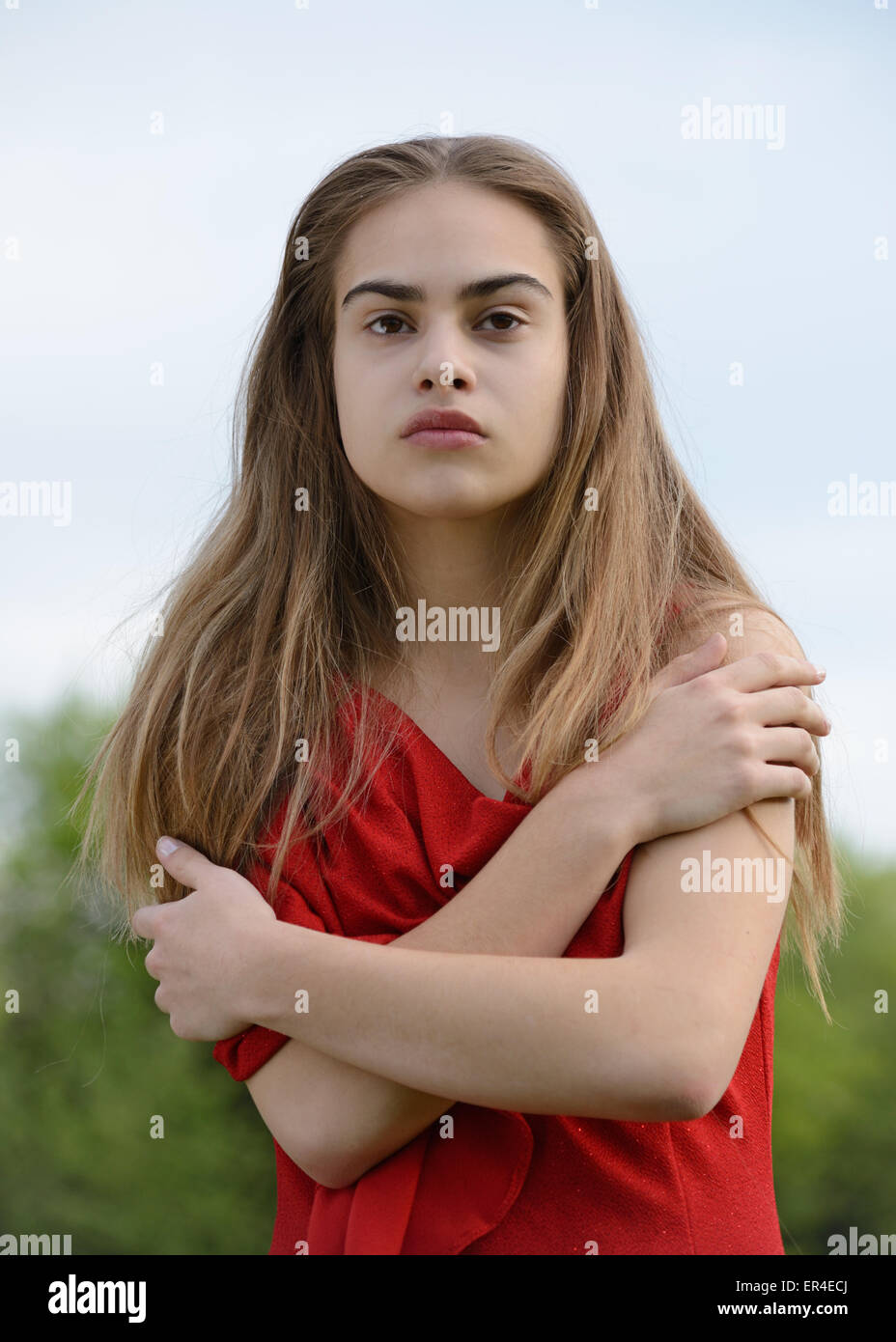 strong beauty, woman in red Stock Photo