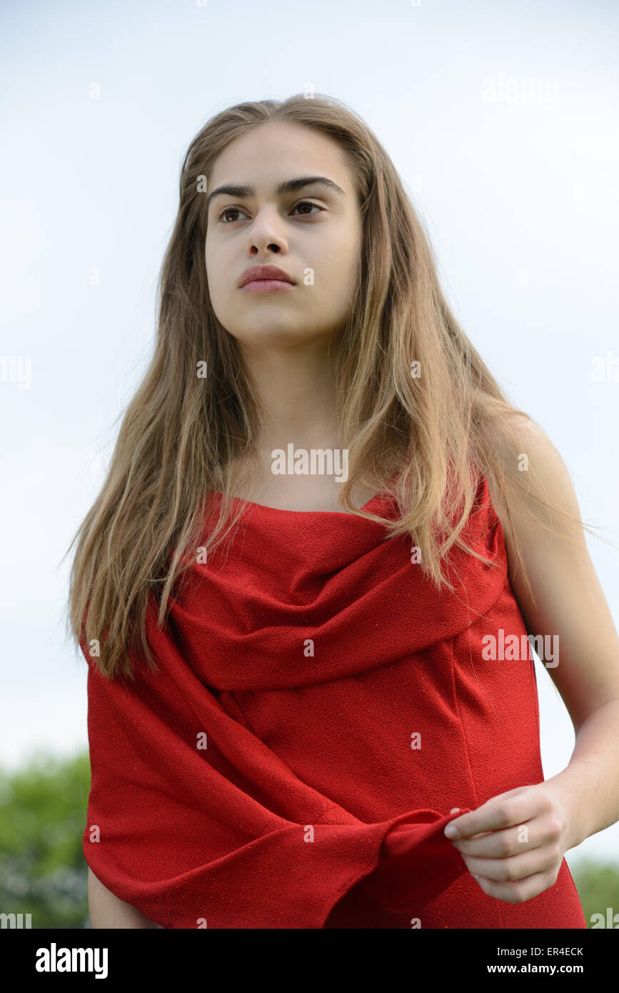 strong beauty, woman in red Stock Photo
