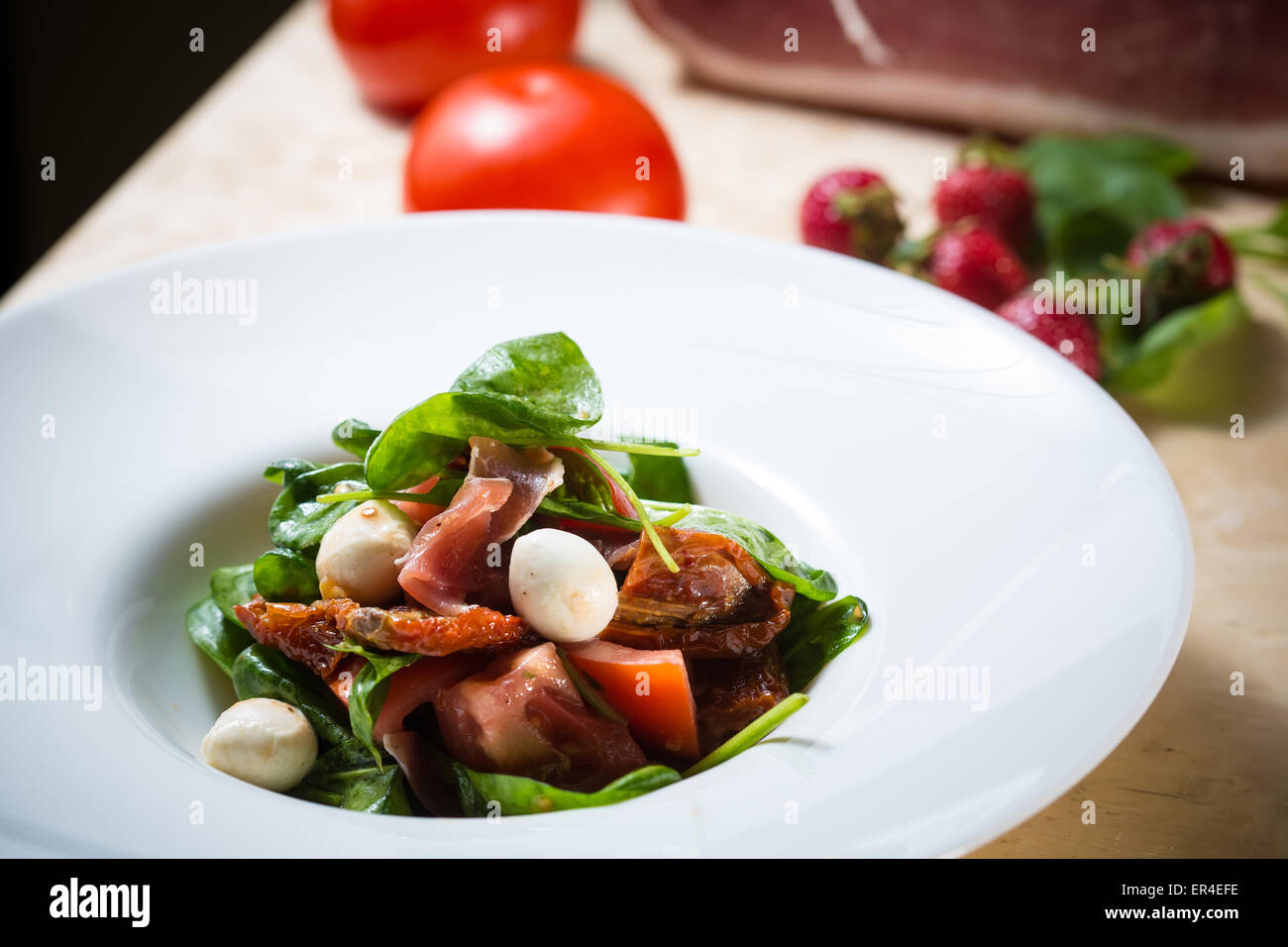 Salad With Strawberry Prosciutto Herbs Cottage Cheese And Stock