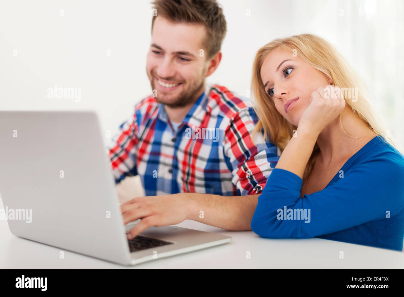 Portrait of couple with contemporary laptop Stock Photo - Alamy