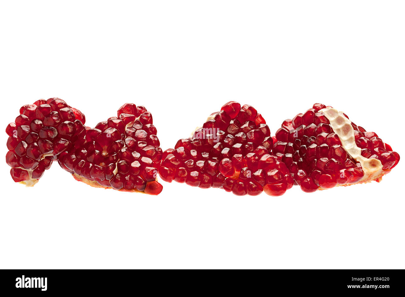Ripe pomegranate closeup isolated on white Stock Photo