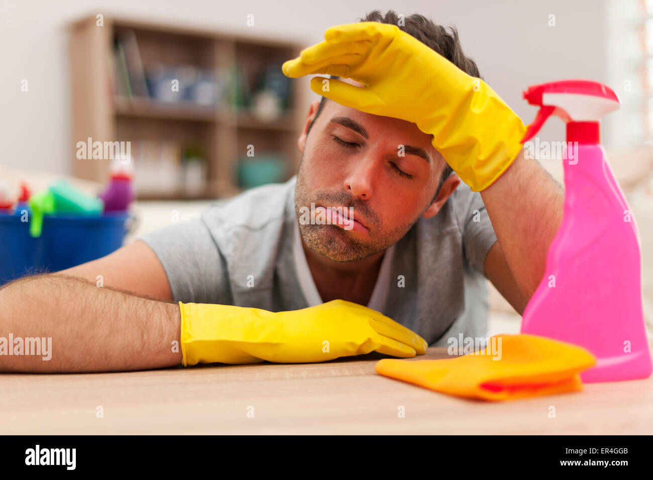 Man tired after cleaning the house Stock Photo Alamy