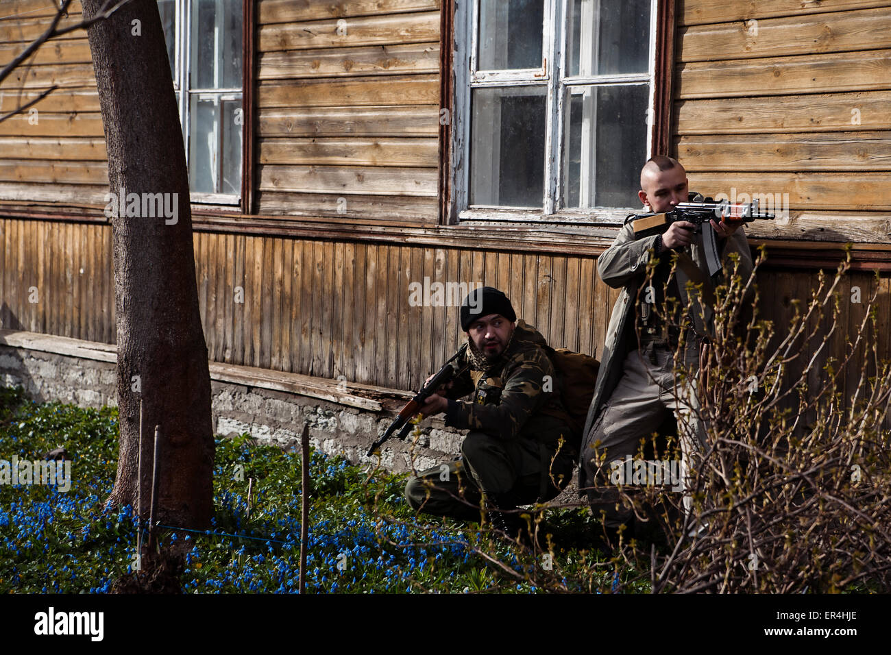 Hunting men are hiding in the bushes Stock Photo