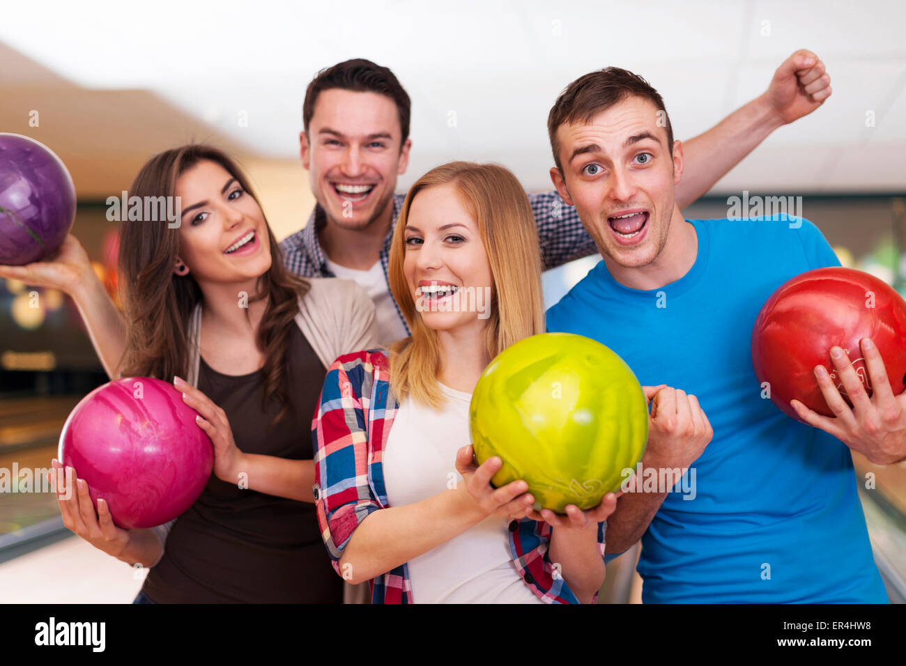 Friends hanging out at the bowling alley Stock Photo