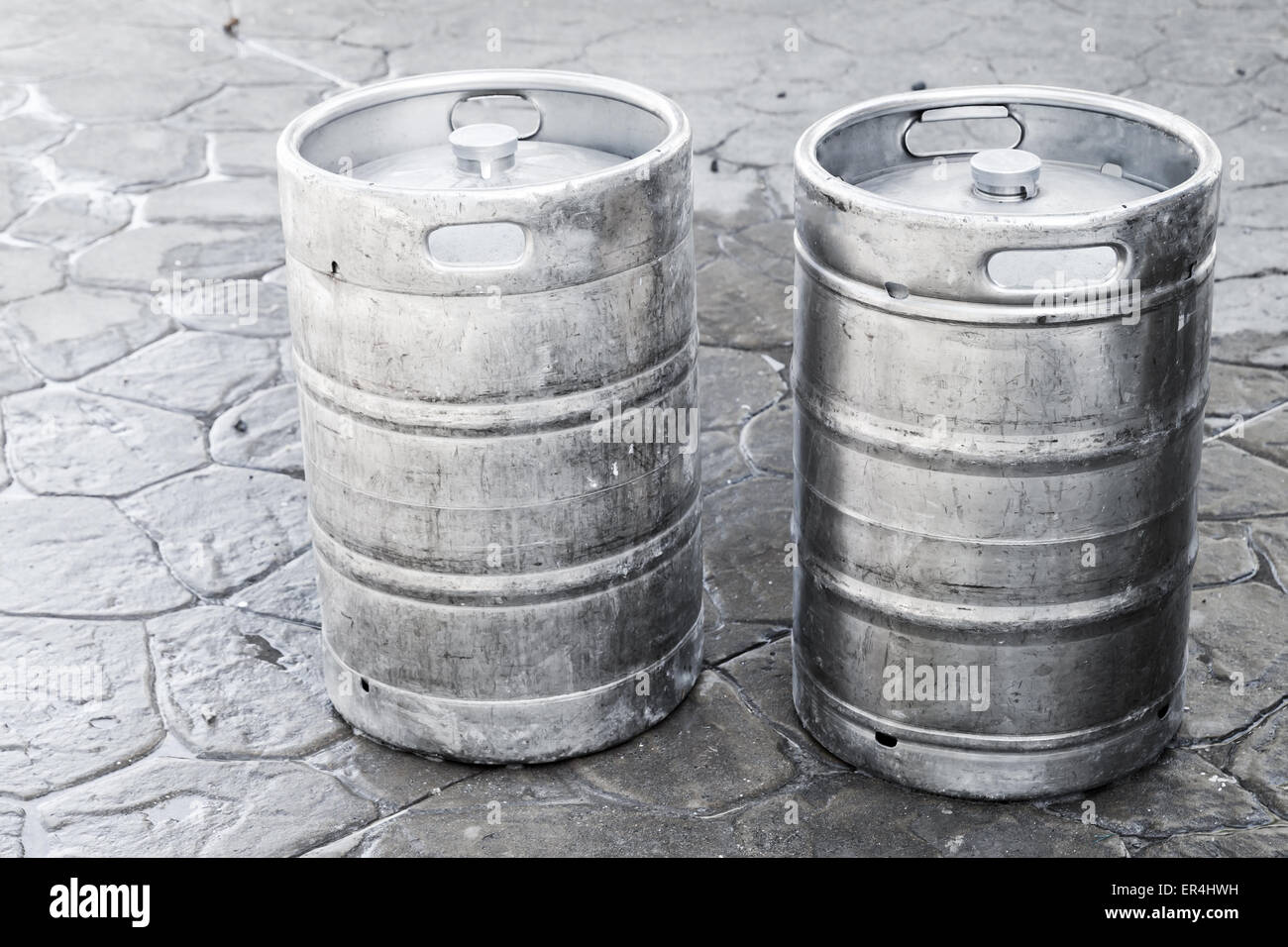 Used aluminum kegs, small barrels commonly used to store, transport, and serve beer Stock Photo