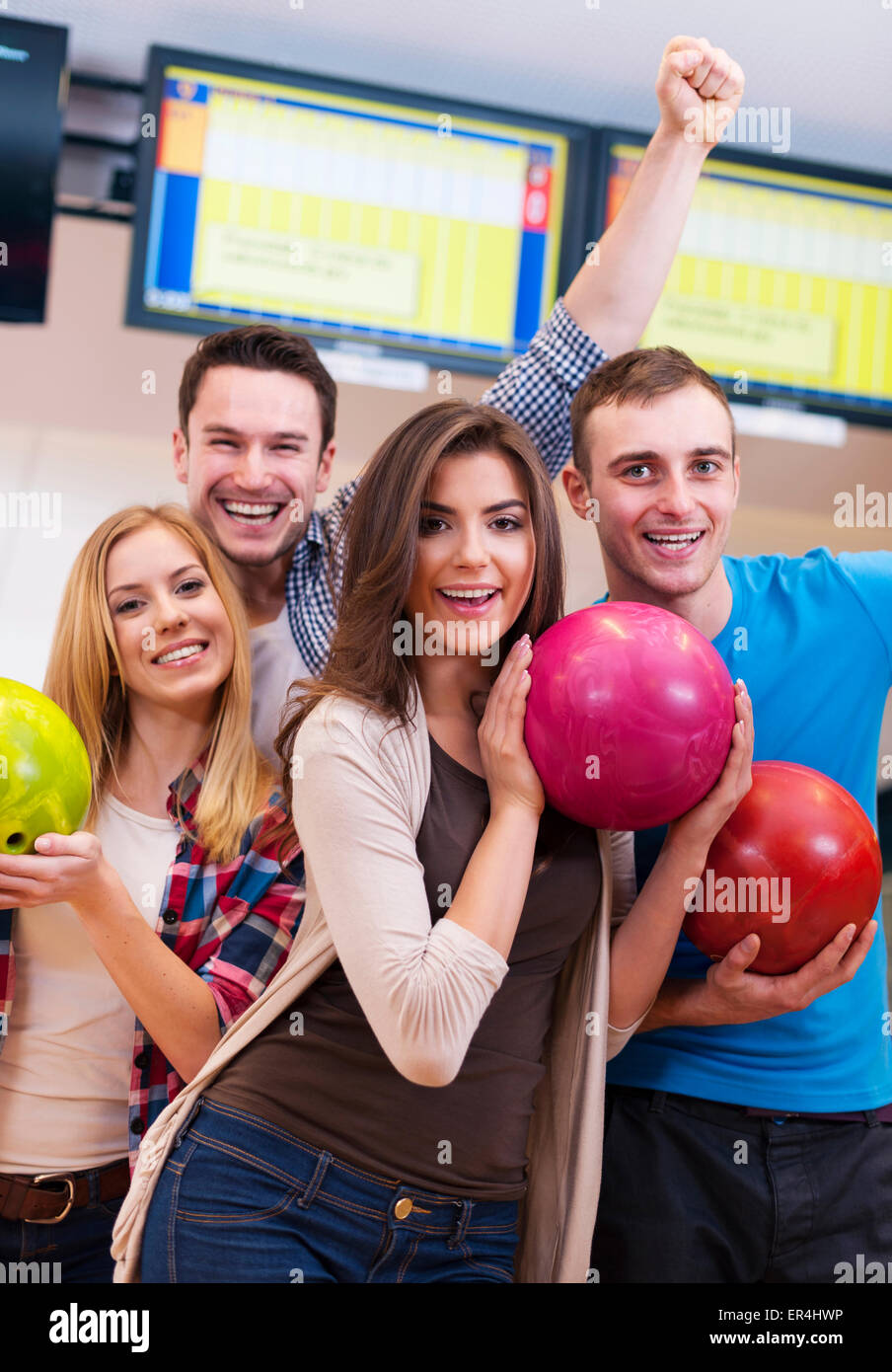 Friends hanging out at the bowling alley Stock Photo