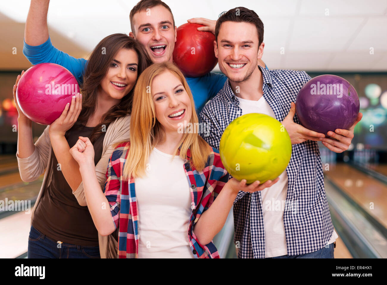 Friends hanging out at the bowling alley Stock Photo