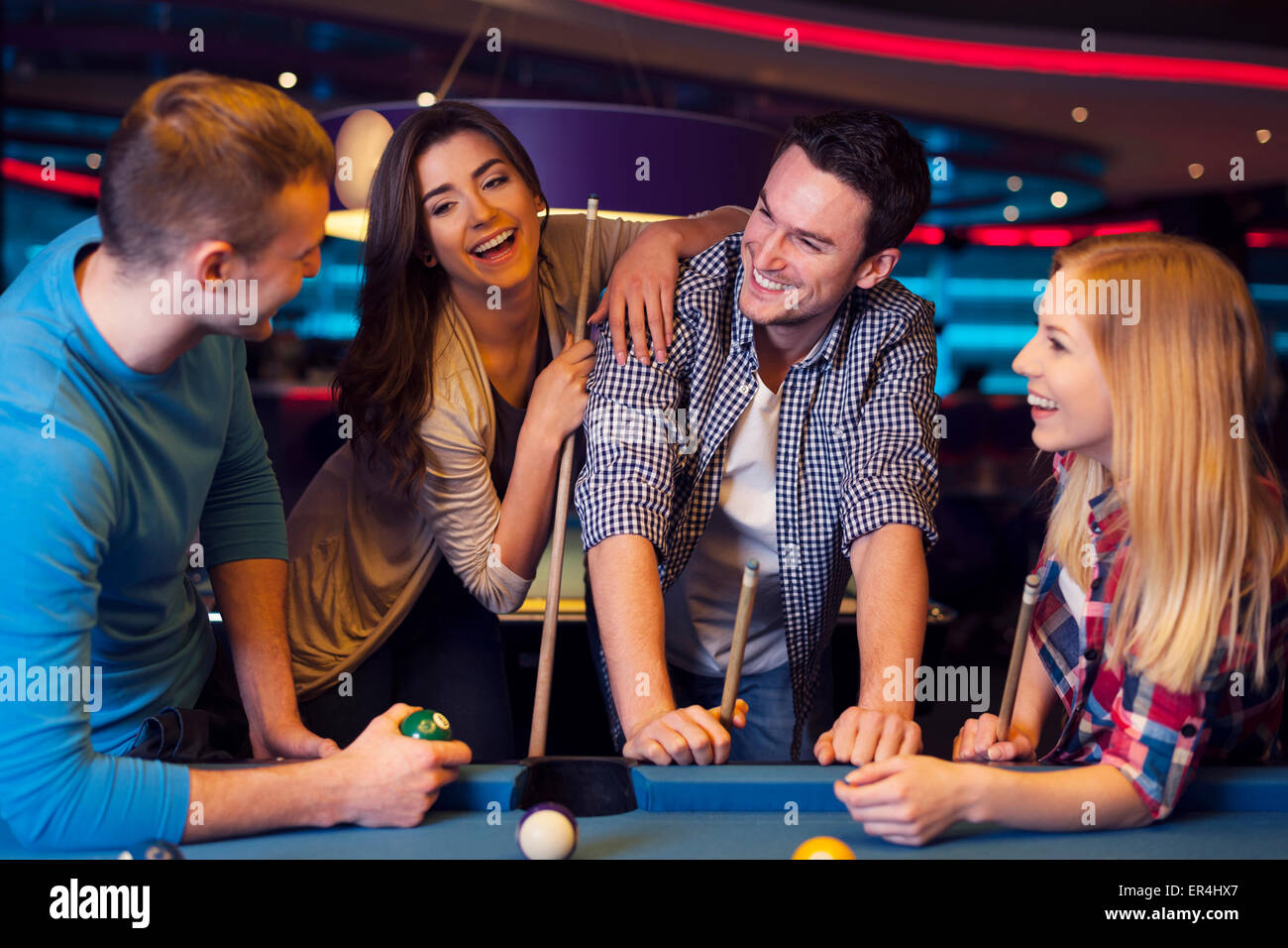 Friends playing pool at a bar Stock Photo Alamy