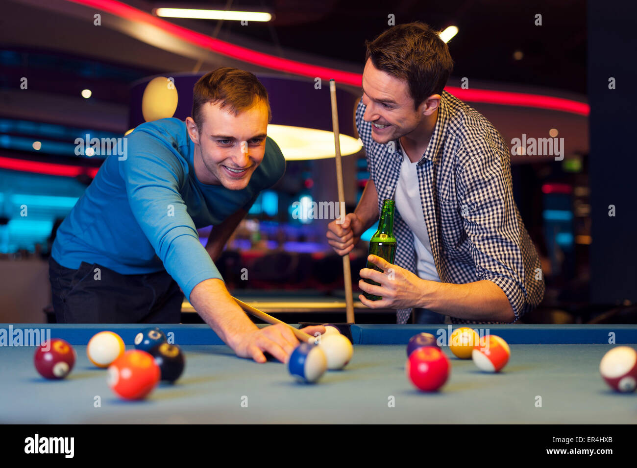 Friends playing pool at a bar Stock Photo Alamy