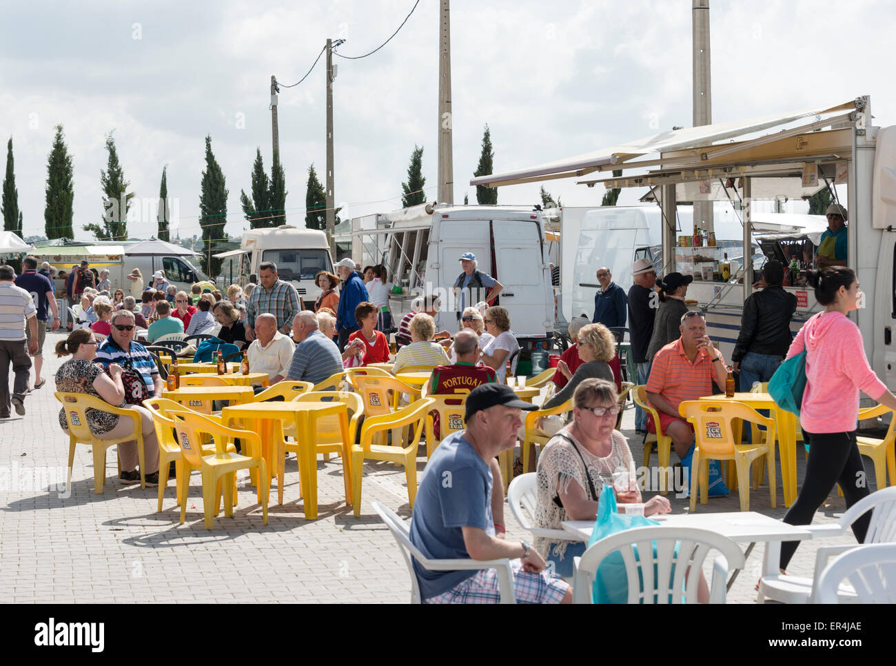 LOULE,PORTUGAL - APRIL 22: people enjoy their drinks and food on the teracce  at the market on April 22, 2015 in Loule, Portugal Stock Photo