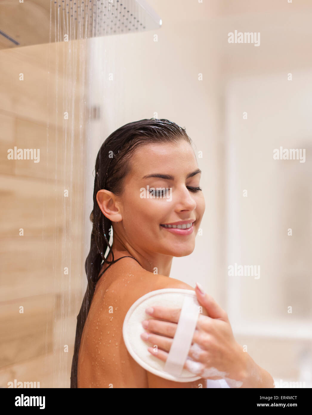 Happy young woman taking shower. Debica, Poland Stock Photo Alamy