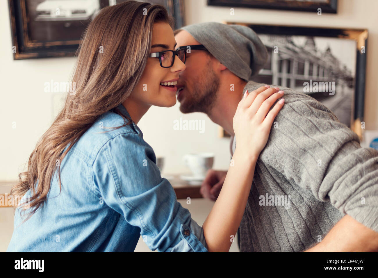 Romantic moments for hipster couple at cafe. Krakow, Poland Stock Photo