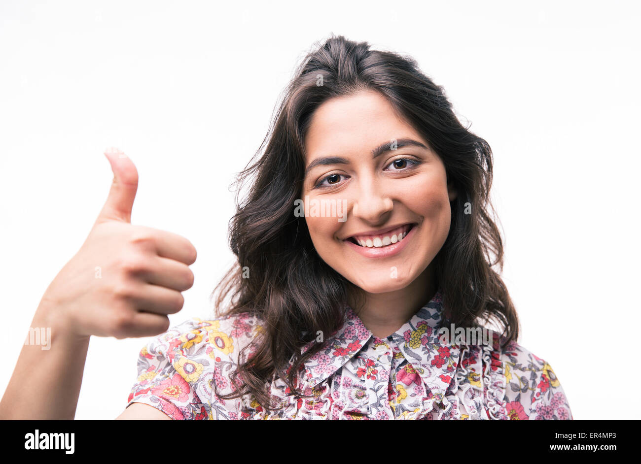 Happy young woman showing thumb up isolated on a white background ...