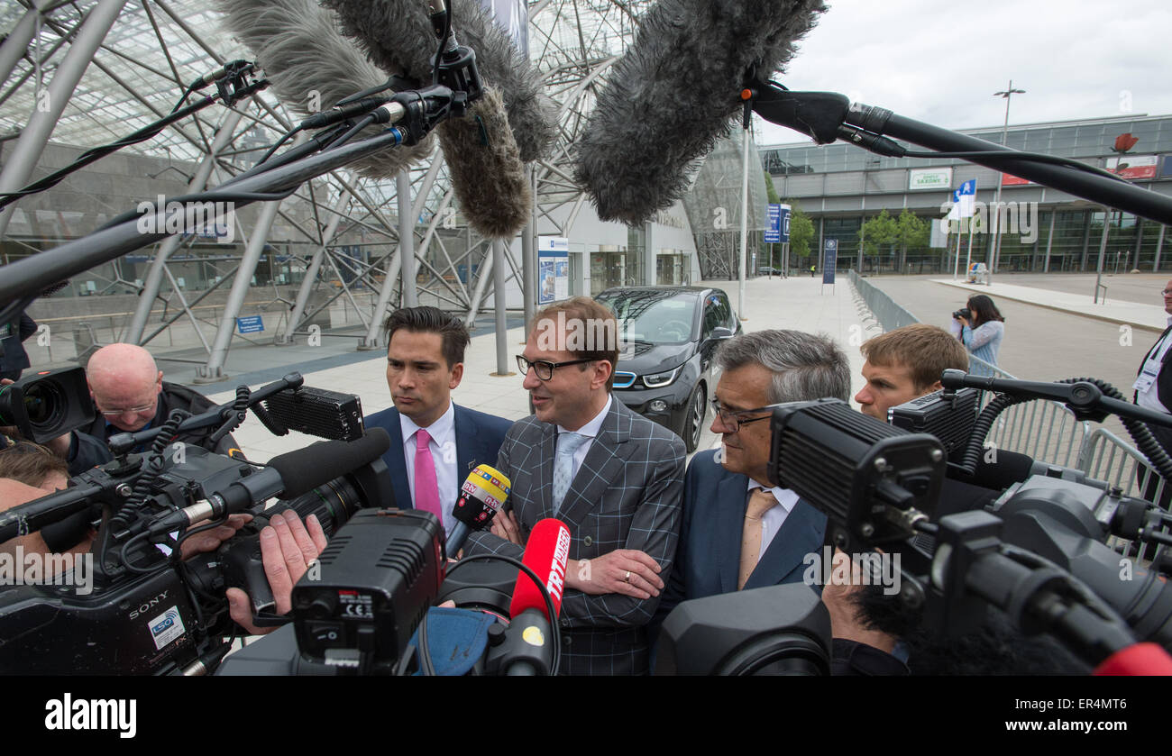 German Transport Minister Alexander Dobrindt (c, CDU), New Zealand Transport Minister Simon Bridges (l) and Secretary General of the International Transport Forum (ITF) José Viegas are interviewed in front of the Congress Center Leipzig, Leipzig, Germany, 27 May 2015. The International Transport Forum involving top politicians, industry representatives and scientists takes place from 27 May to 29 May and is an inter-governmental organization with 54 Member States. Photo: PETER ENDIG/dpa Stock Photo