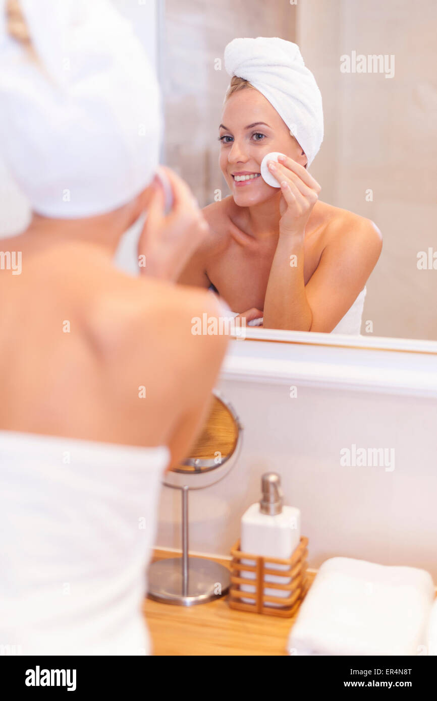 Woman cleaning face over sink hi-res stock photography and images - Alamy