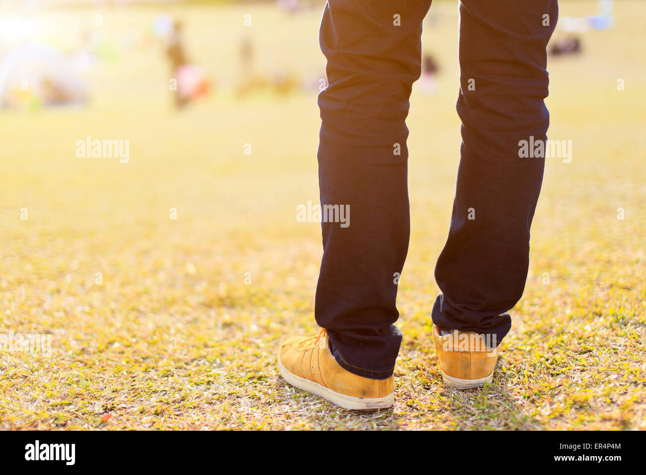 Man's leg under sunset Stock Photo