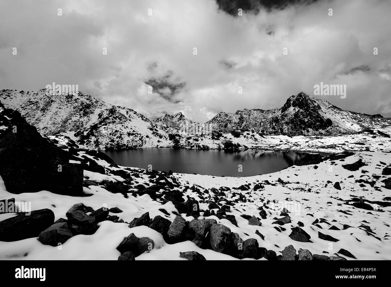 Gosaikunda - a frozen lake high up in Himalayas, in Nepal's Langtang National Park Stock Photo