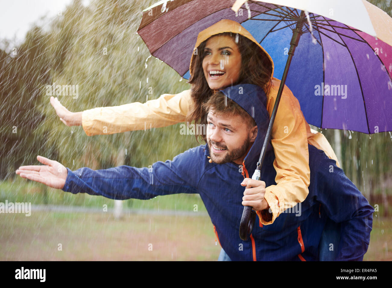 Let's hide under an umbrella in rain. Debica, Poland Stock Photo