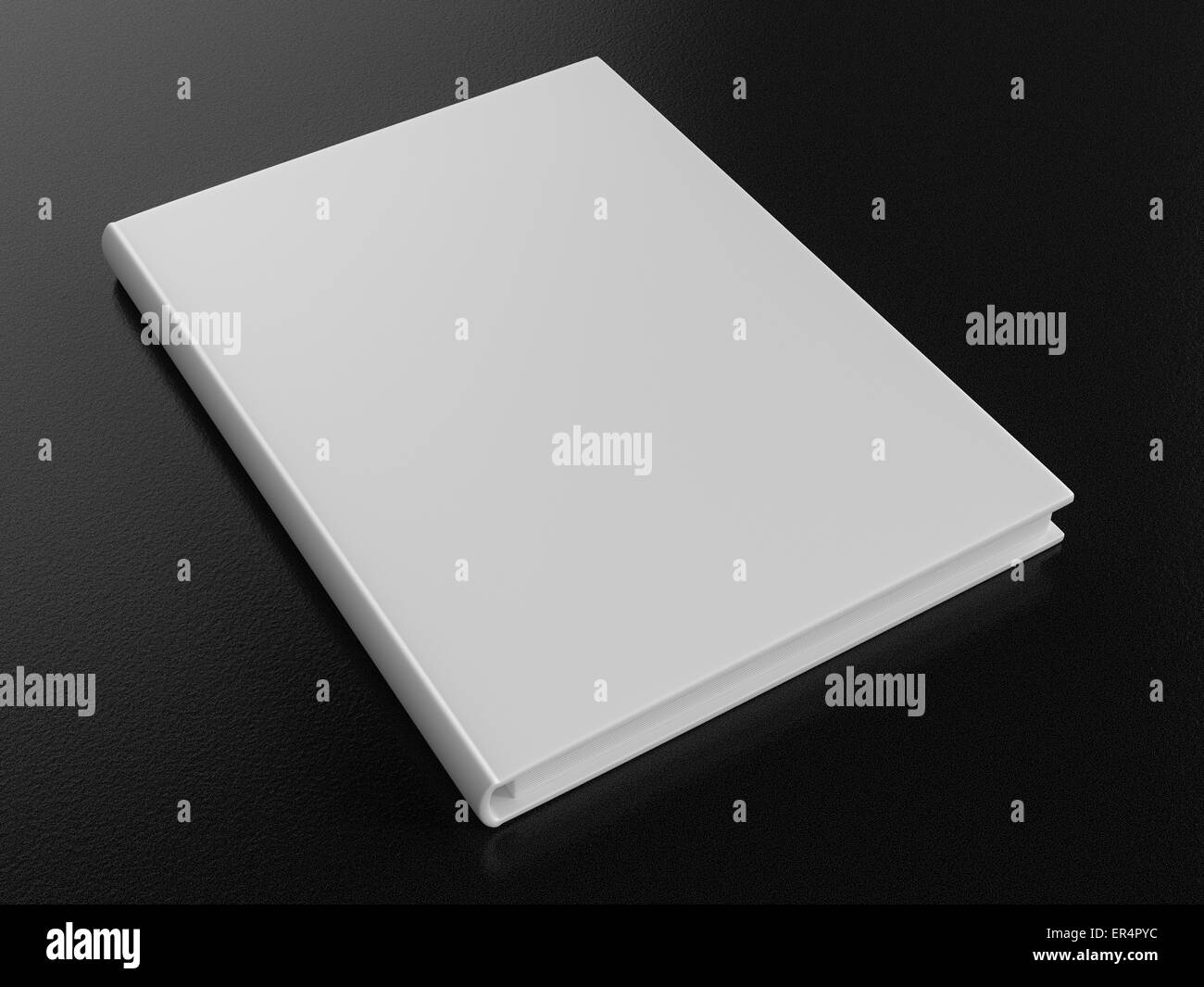 Single blank white book on a dark rough background. Stock Photo