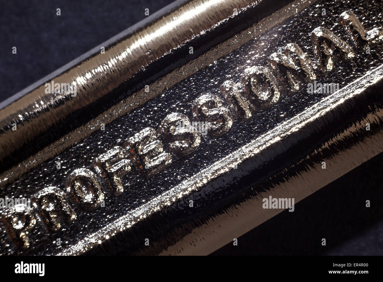 Written word on metal, part of industrial tool. Stock Photo