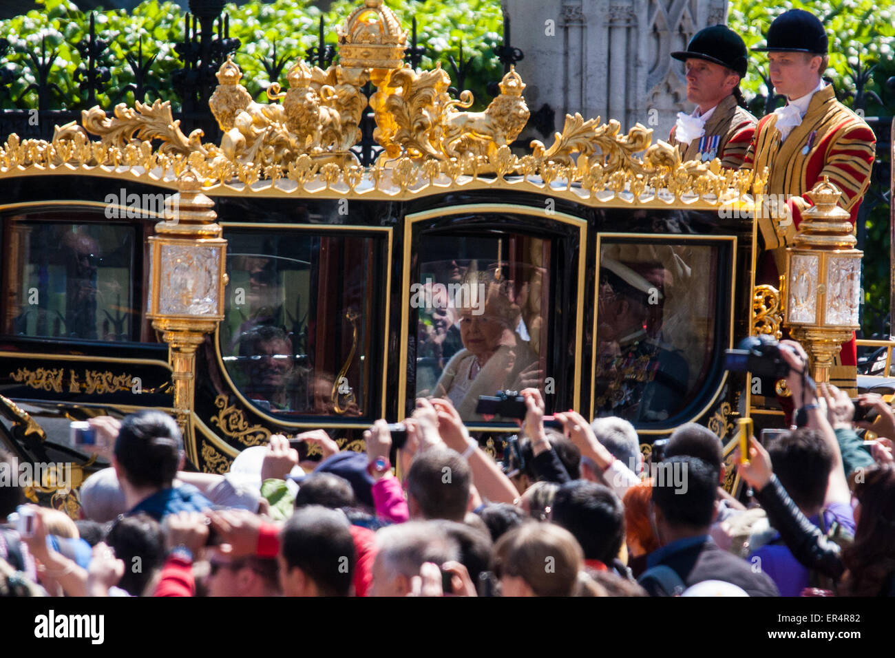 London, UK. 27th May, 2015. The Queen looks out at the crowd as she leaves Parliament in her carriage. Credit:  Paul Davey/Alamy Live News Stock Photo