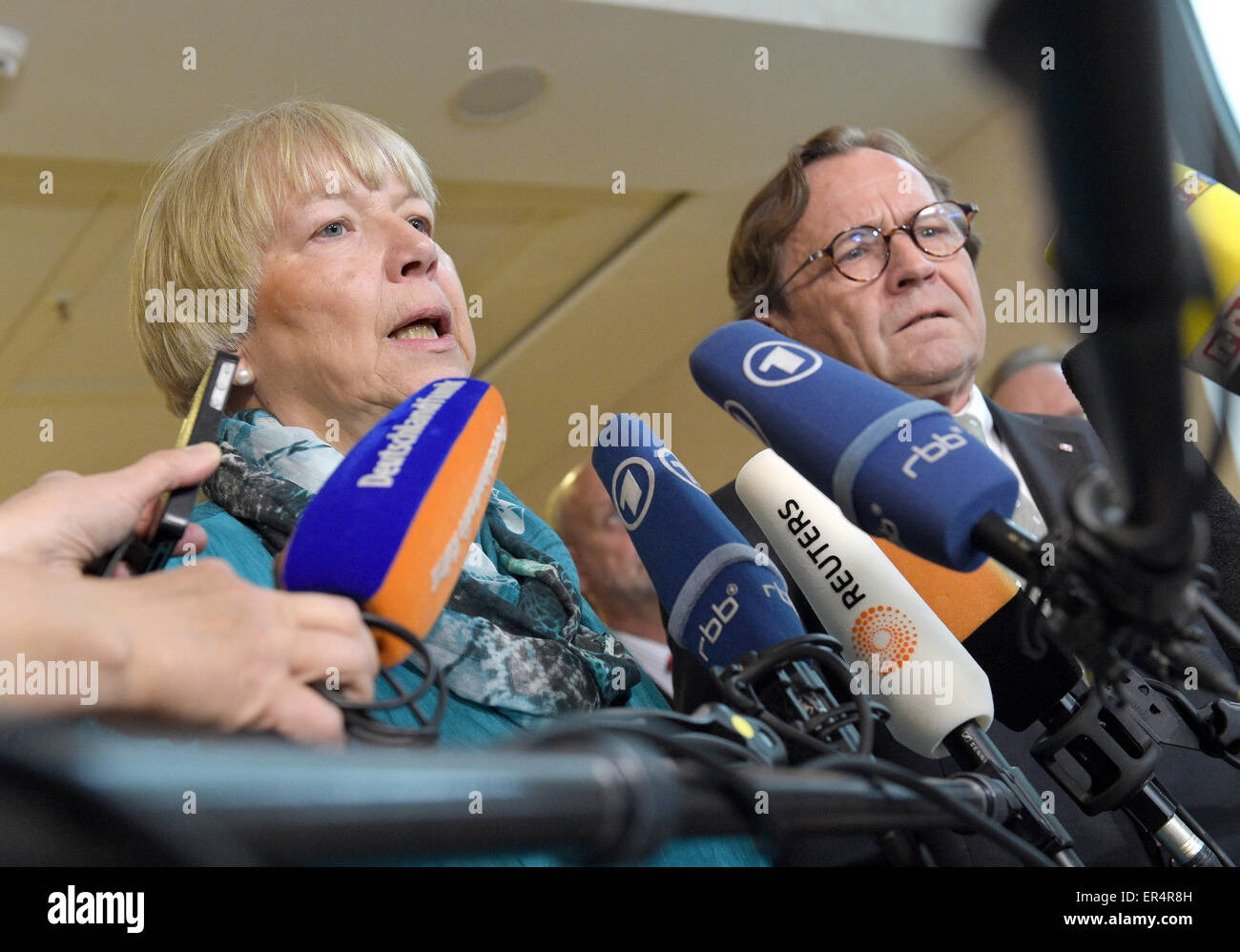 Berlin, Germany. 27th May, 2015. Deputy Chairman of the Railway and Transport Union (EVG) Regina Rusch-Ziemba (L) and Chief Human Resources Officer of Deutsche Bahn AG Ulrich Weber speak to members of the press in Berlin, Germany, 27 May 2015. Deutsche Bahn and the EVG have reached an agreement on labour provisions. Photo: Rainer Jensen/dpa/Alamy Live News Stock Photo