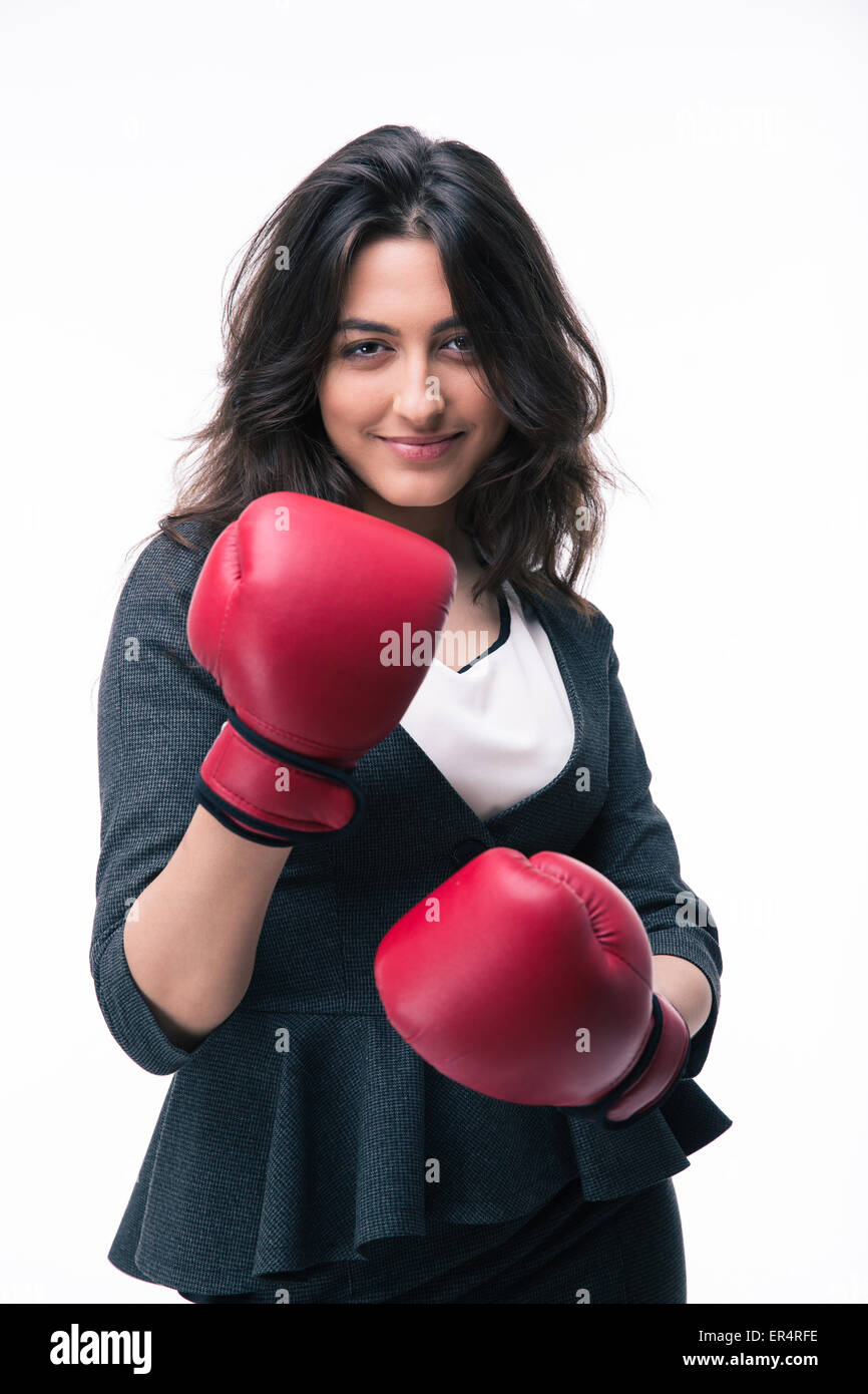 Portrait of a happy businesswoman in boxing gloves isolated on a white background. Looking at camera Stock Photo