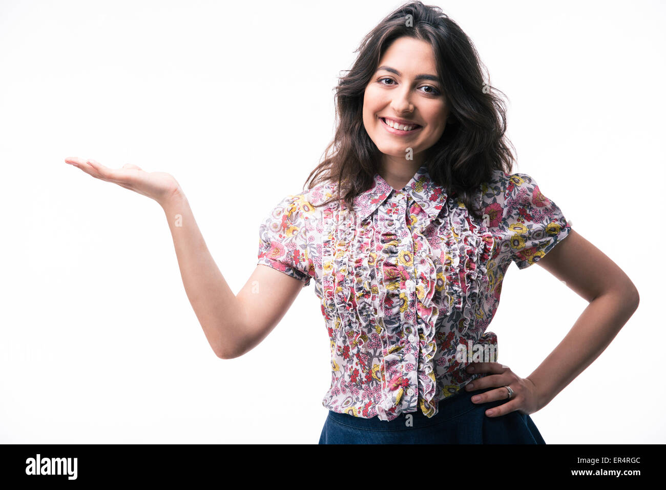 Happy woman presenting copy space on her palm isolated on a white ...