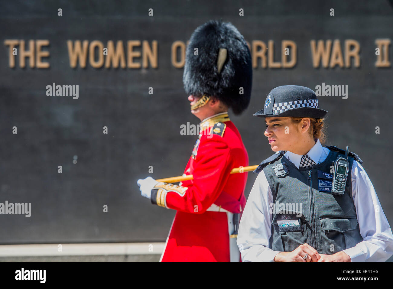 London, UK. 27th May, 2015. Security is tight with armed police guarding the armed soldiers. The Queen, Prince Charles and her crown pass down Whitehall, in carriages of state,  on their return from the State Opening of Parliament.Whitehall, London, UK, 27 May 2015. Credit:  Guy Bell/Alamy Live News Stock Photo