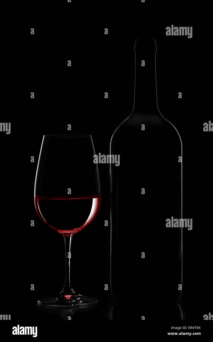 Red wine bottle and wine glass on black background Stock Photo Alamy
