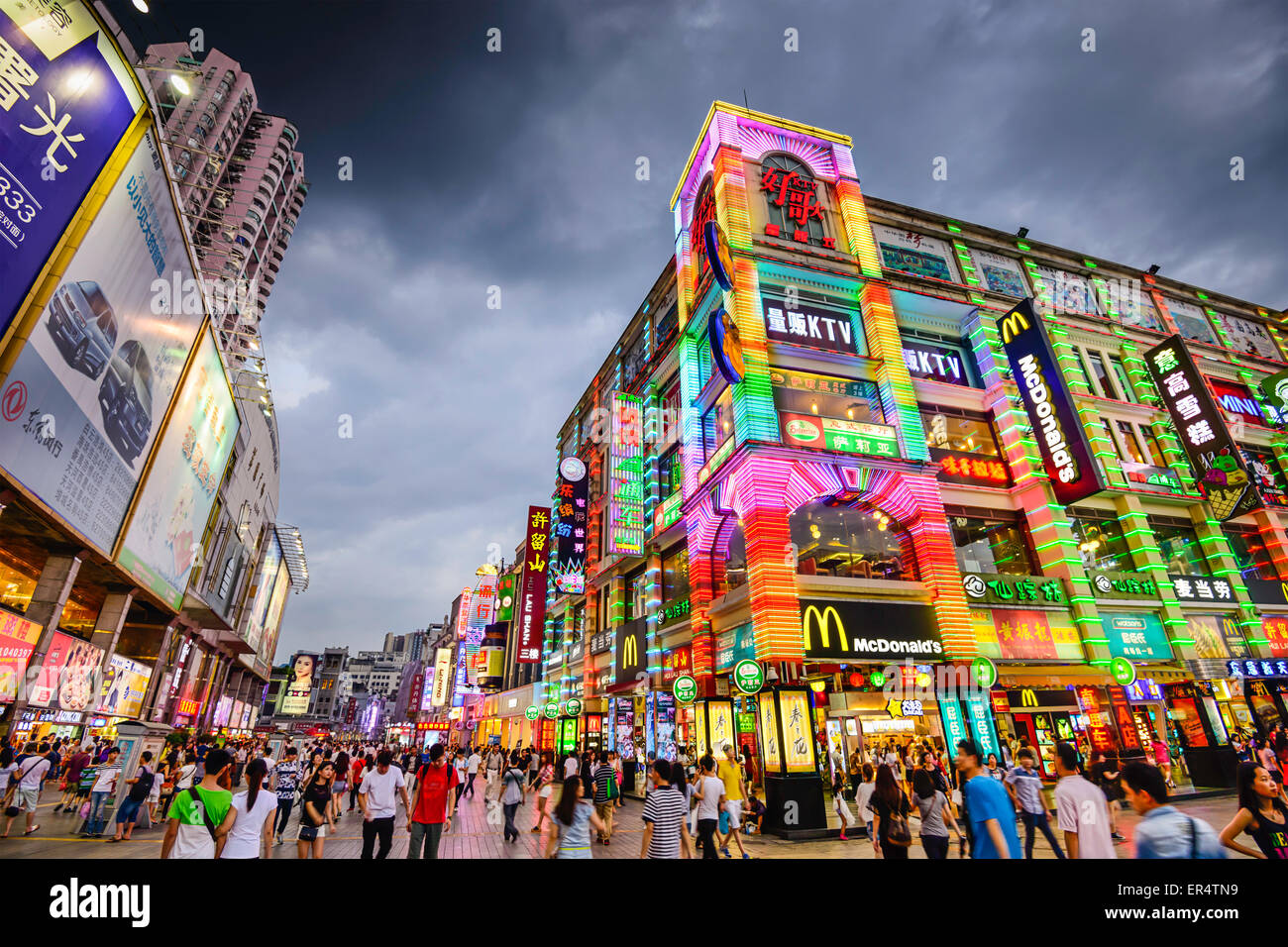 Pedestrians pass through Shangxiajiu Pedestrian Street in Guangzhou, China. Stock Photo