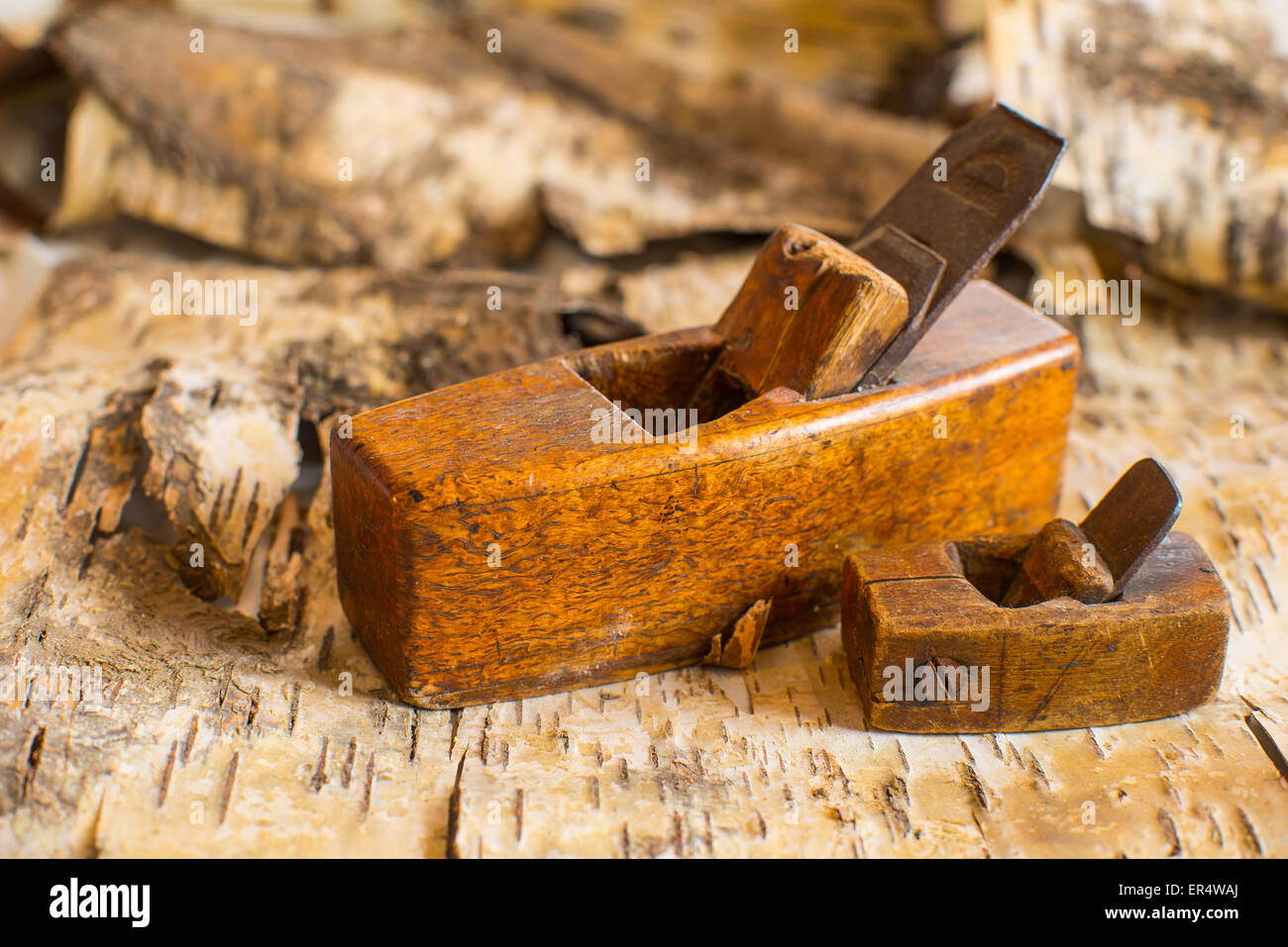 Old carpenter's hand tools and birchbark Stock Photo