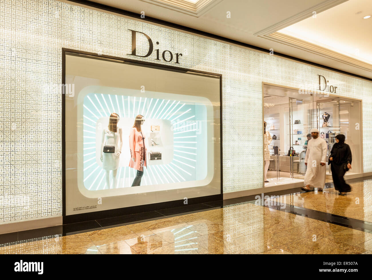 Arab shoppers outside Christian Dior Shop Dubai Mall Dubai City United Arab Emirates UAE Middle east Stock Photo