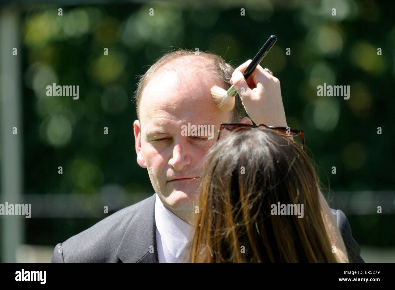 Douglass Carswell being made up before a TV interview on College Green, Westminster Stock Photo