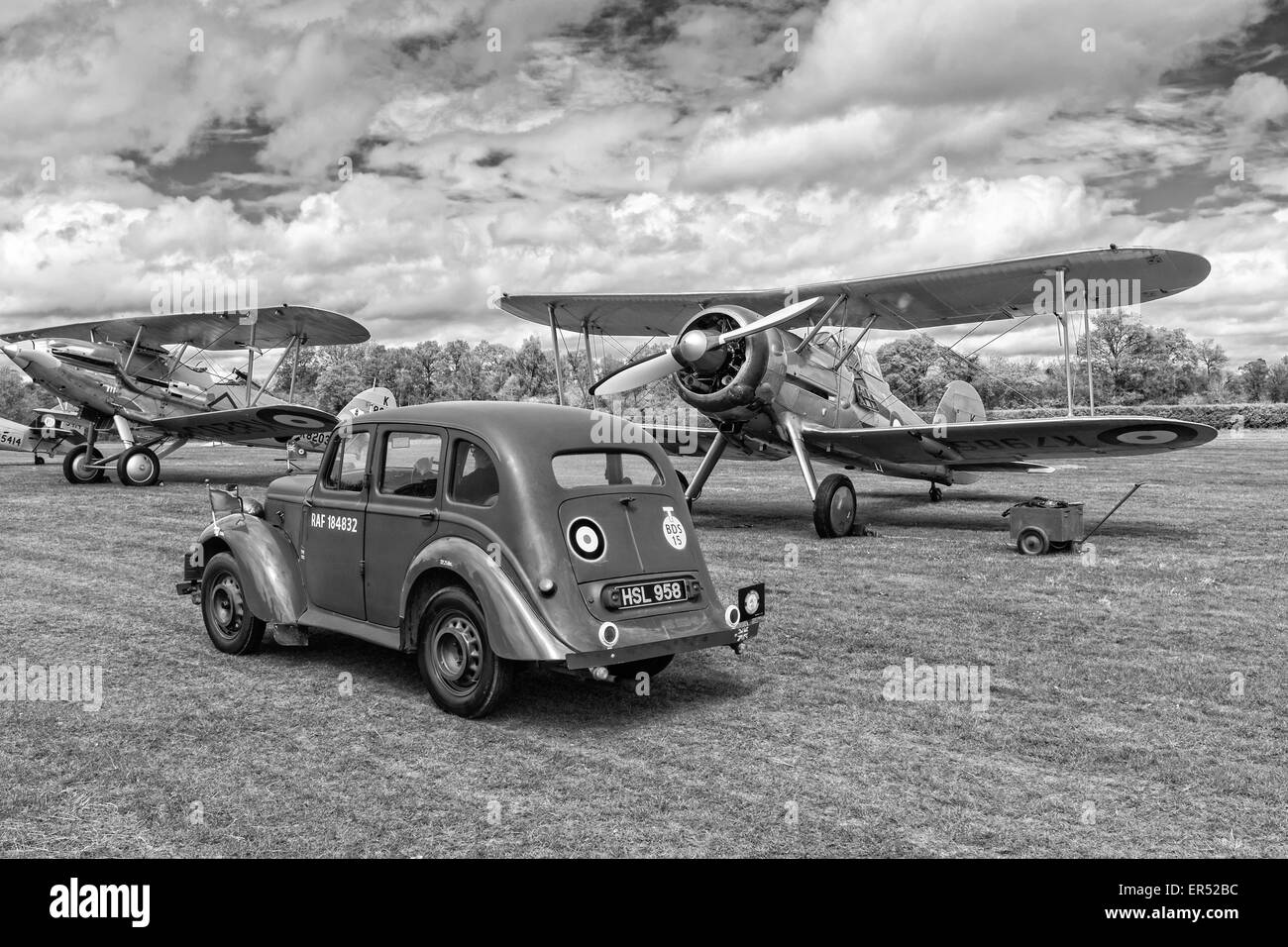 1938 Hillman Minx, Gloster Gladiator and Hawker Demon on the flightline at The Shuttleworth Collection, Old Warden Stock Photo