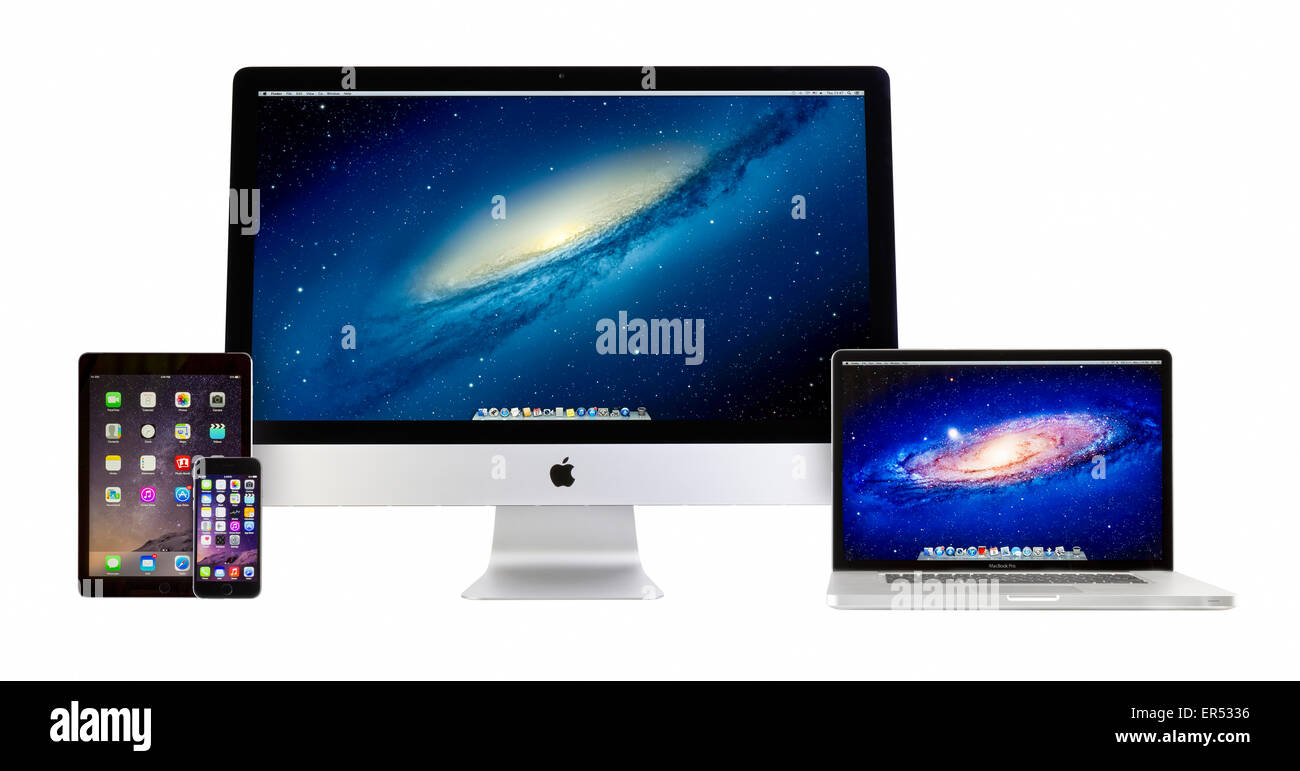 Apple iMac 27 inch desktop computer, Macbook Pro, iPad Air 2 and iPhone 6 on white background Stock Photo