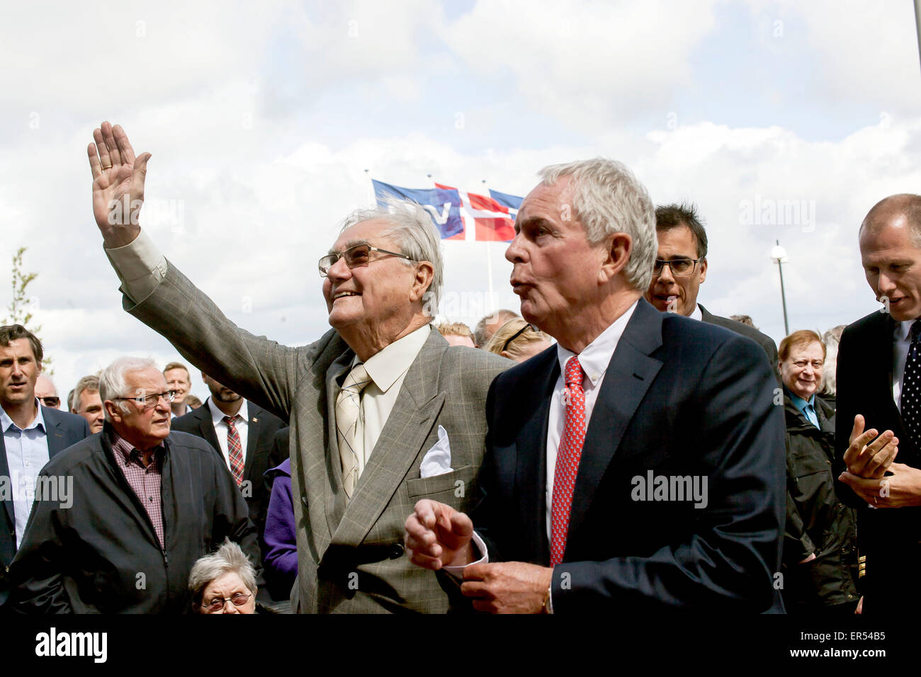 Hedehusene, Denmark, May 27th, 2015: Prince Concort Henrik (2nd, R) waves to bystanders as he arrives to DSV’s new head quarter in Hedehuene near Copenhagen. The Prince Concort reveiled his new sculpture, “The Creative Hand”, which stands near the entrence to DSV. At the photo he is followed by DSV chairman, Kurt Larsen (1st, R) Credit:  OJPHOTOS/Alamy Live News Stock Photo