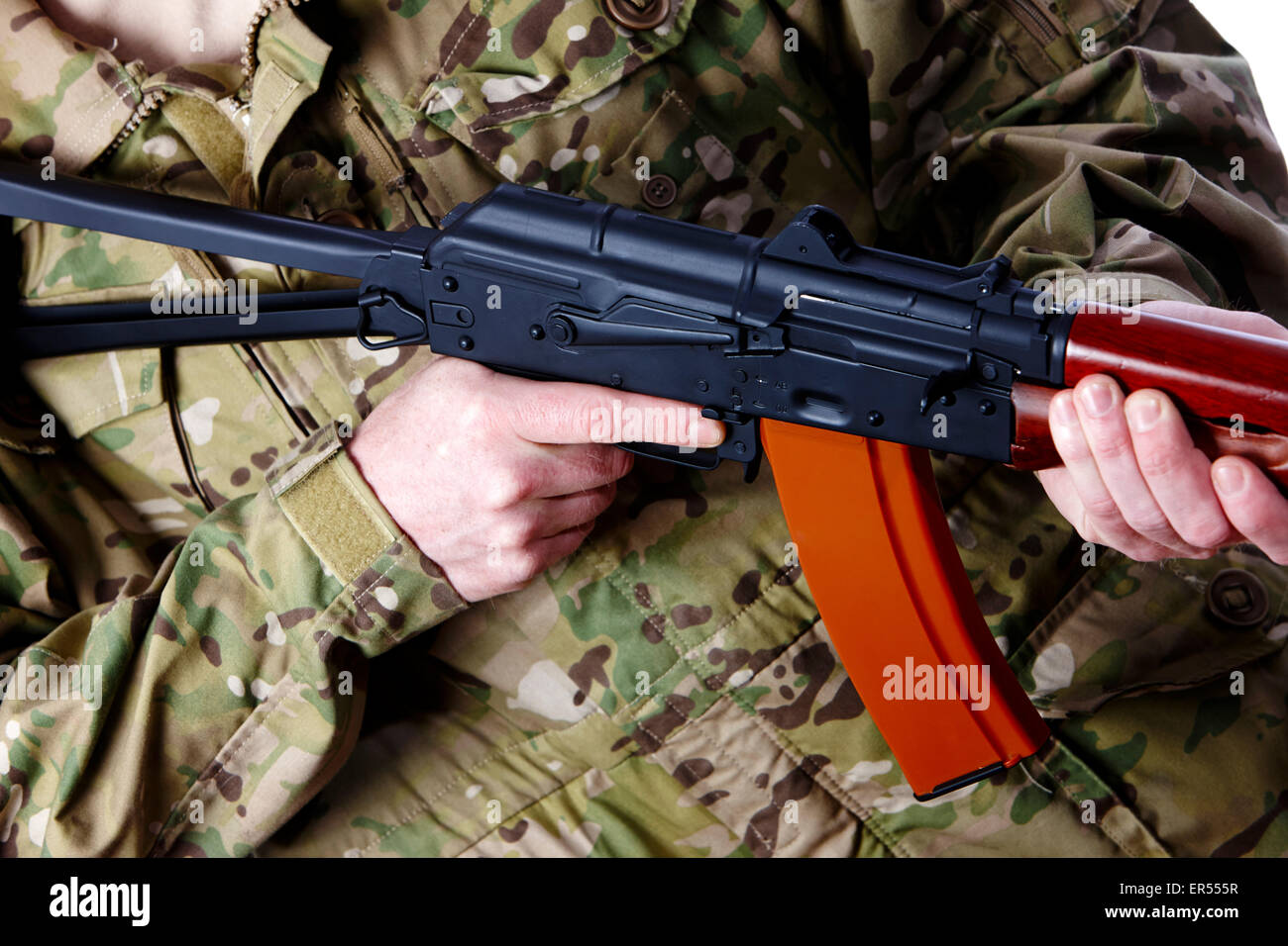 man in combat fatigues holding aks-47u close quarter combat kalashnikov rifle Stock Photo