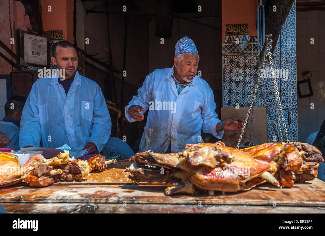 MARRAKESH, MOROCCO - April, 09, 2013: Sellers of roasted lamb in Marrakesh, Morocco Stock Photo