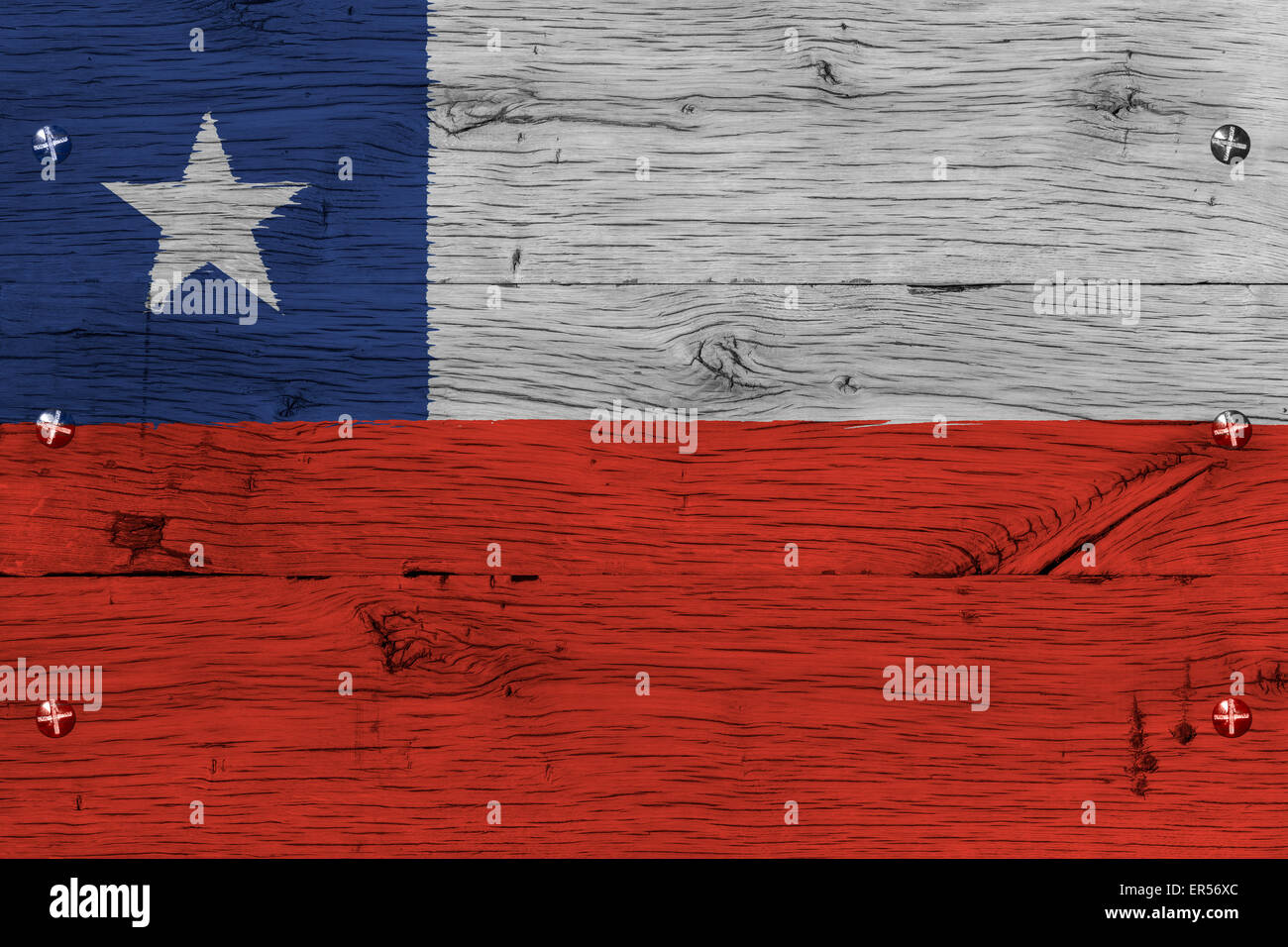 Chile national flag. Painting is colorful on old oak wood of train carriage. Fastened by screws or bolts. Stock Photo
