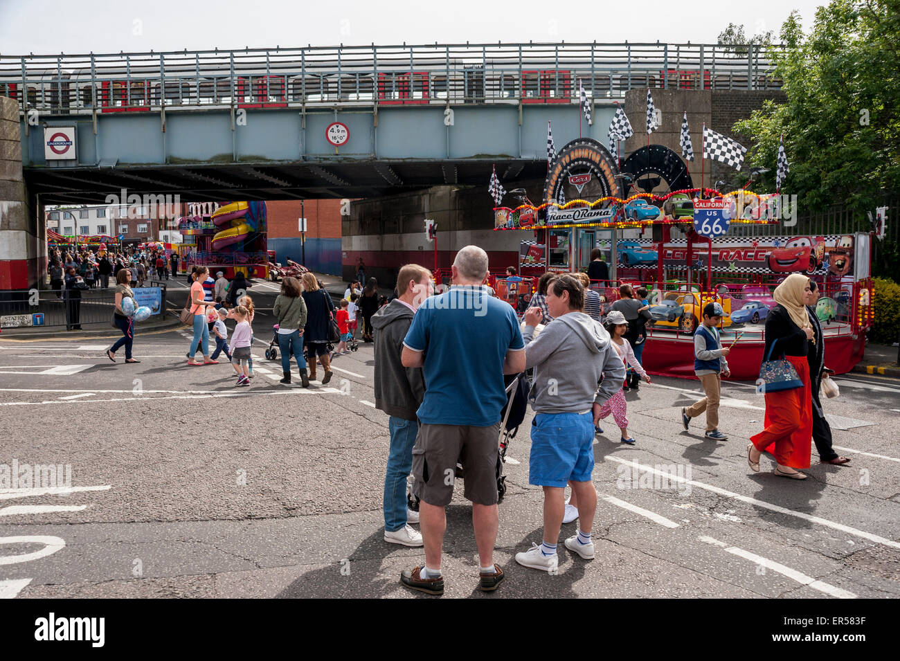 Pinner, London, UK. 27 May 2015. A Metropolitan tube passes over a