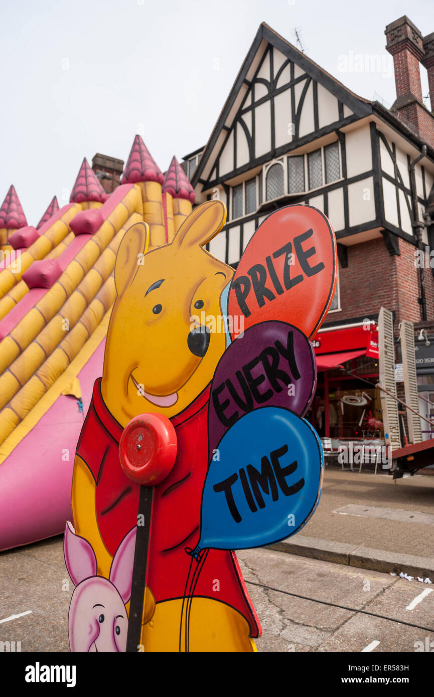 Pinner, London, UK. 27 May 2015. Modern rides and stalls contrast with