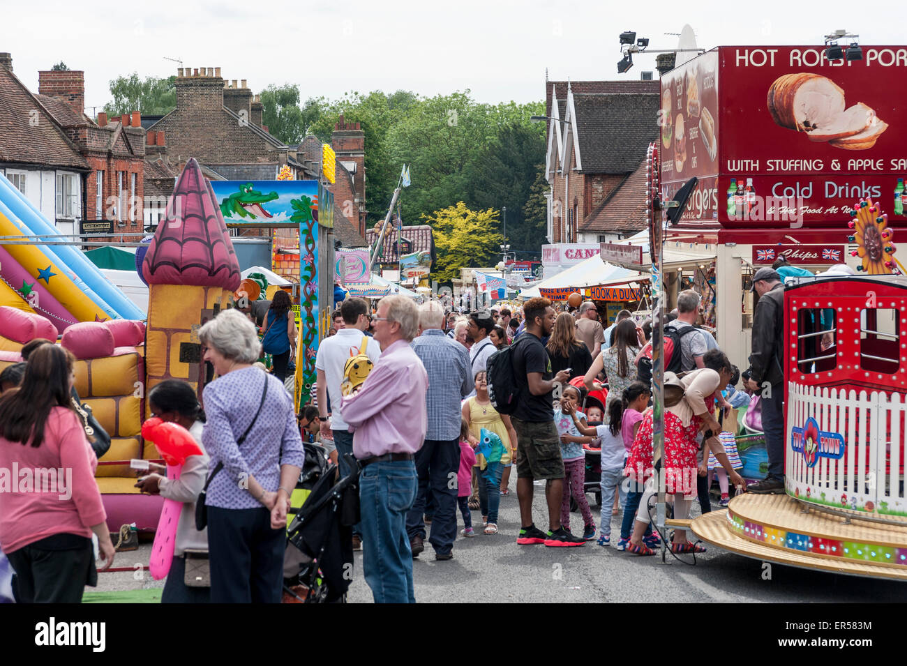 Pinner, London, UK. 27 May 2015. Modern rides and stalls contrast with