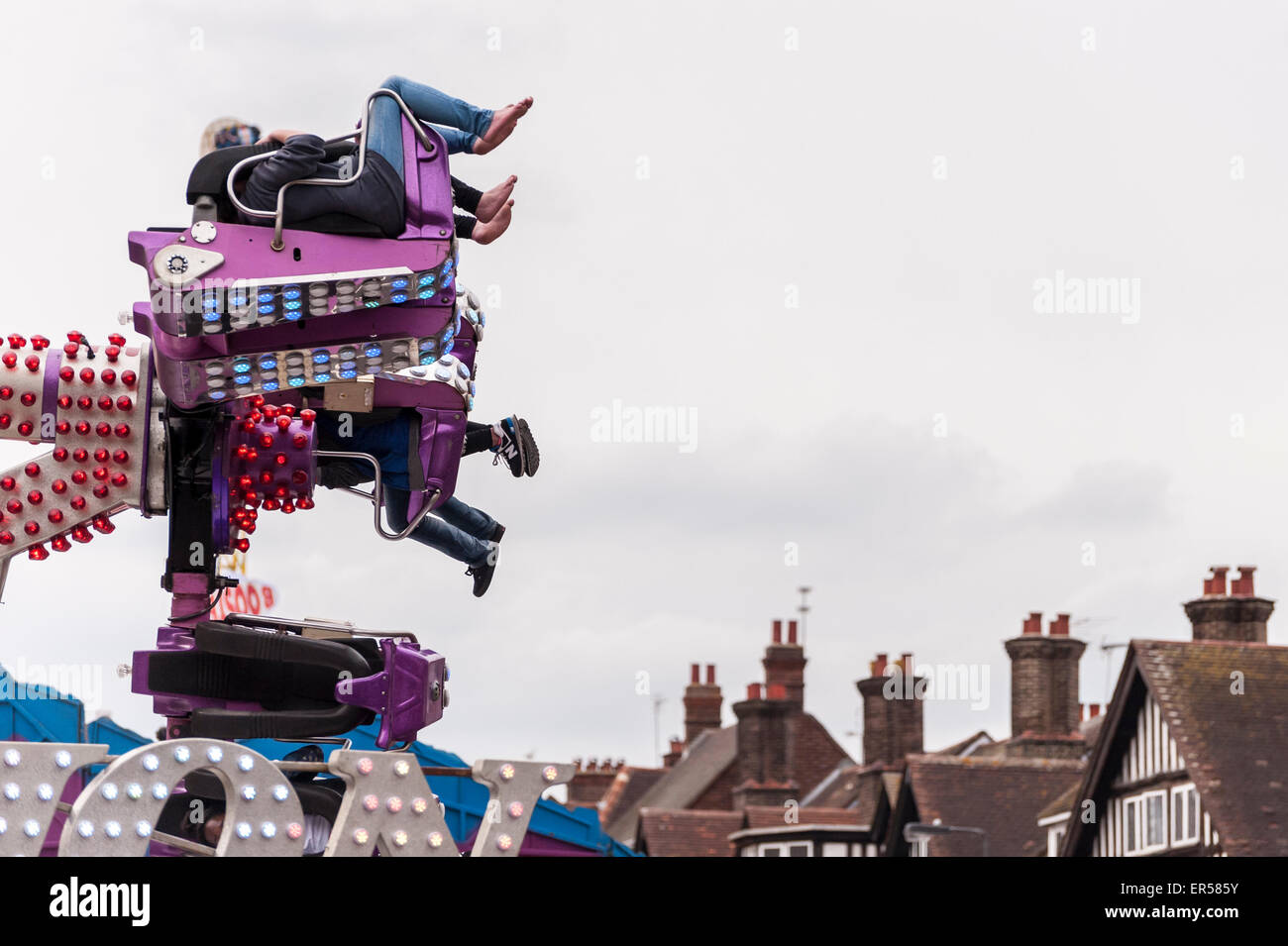 Pinner, London, UK. 27 May 2015. Customers on an aerial spinning ride