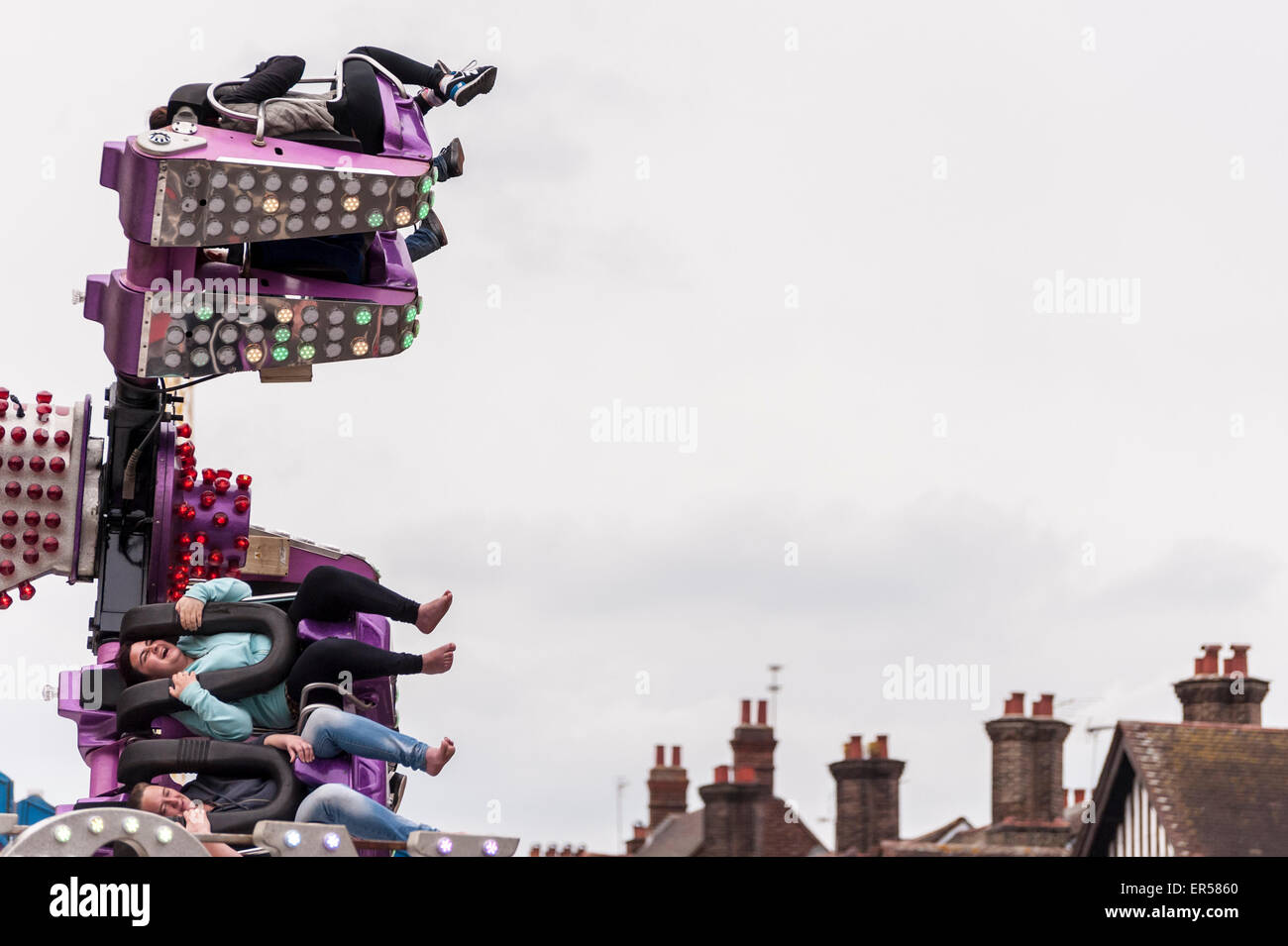 Pinner, London, UK. 27 May 2015. Customers on an aerial spinning ride