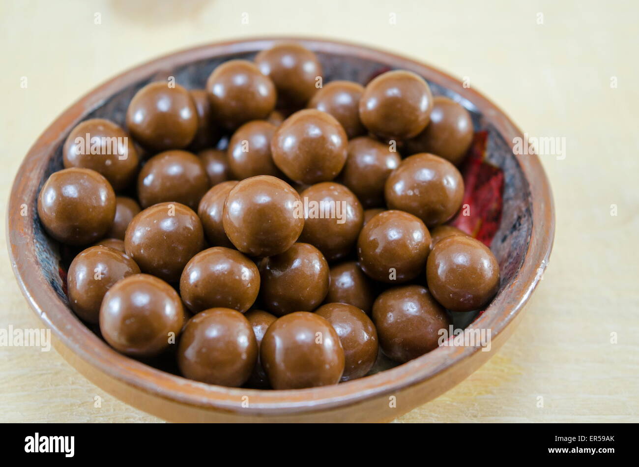 Shiny chocolate balls in a plate Stock Photo