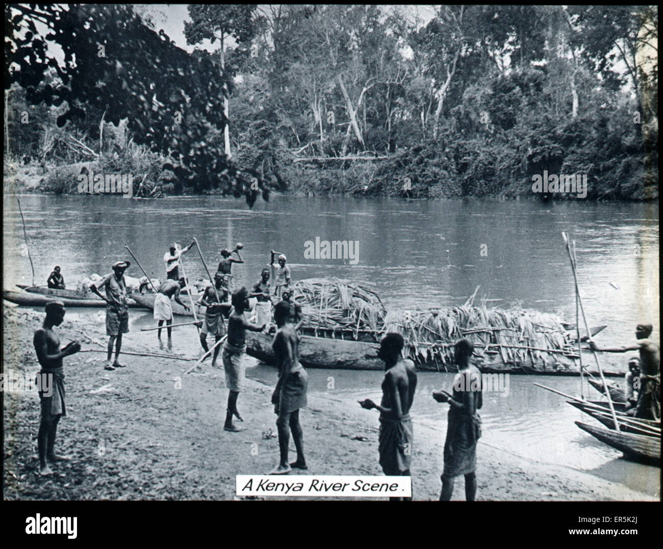 Kenya - Natives with River Boats Stock Photo - Alamy