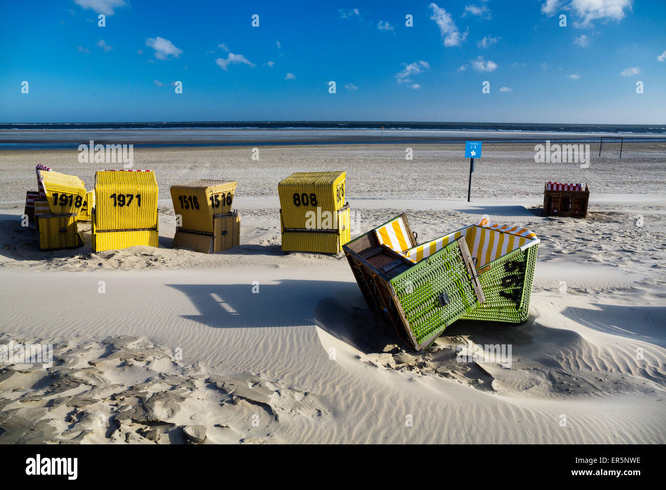 Beach chairs on the beach after a stormy night, Langeoog Island, North Sea, East Frisian Islands, East Frisia, Lower Saxony, Ger Stock Photo