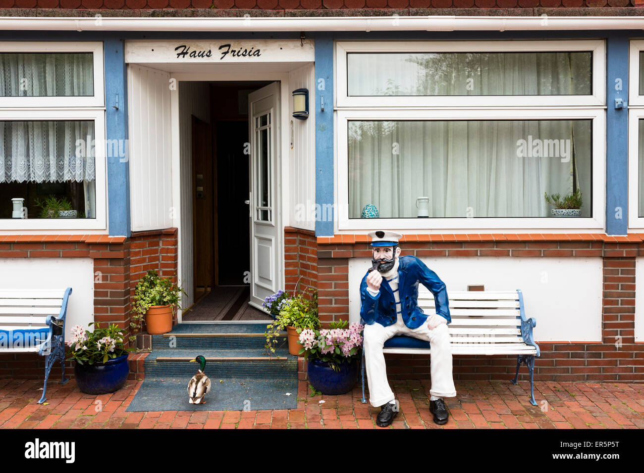 Seafarer and duck in front of a frisian house, Juist Island, Nationalpark, North Sea, East Frisian Islands, East Frisia, Lower S Stock Photo