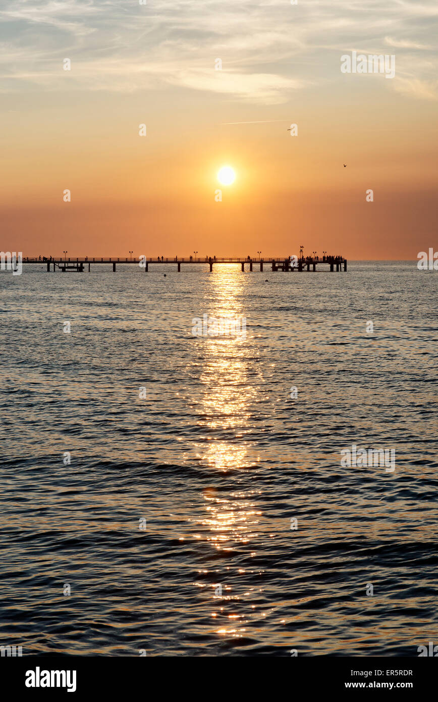 Pier at sunset, seaside resort of Kuehlungsborn at the Baltic Sea, Mecklenburg-Western Pomerania, Germany Stock Photo